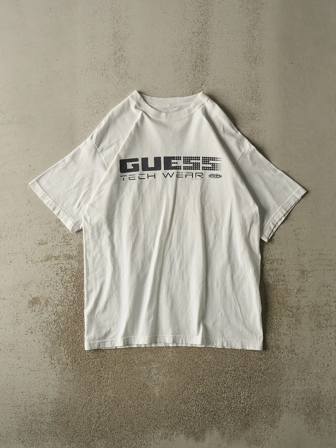 Vintage 96' White Guess Tech Wear Tee (XXL) sold by Rebalance Vintage