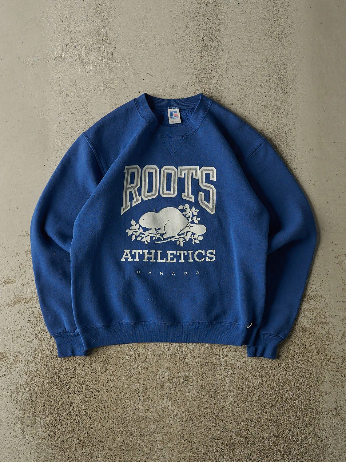 Vintage 80s Blue Russell Athletic x Roots Crewneck (S) sold by Rebalance Vintage