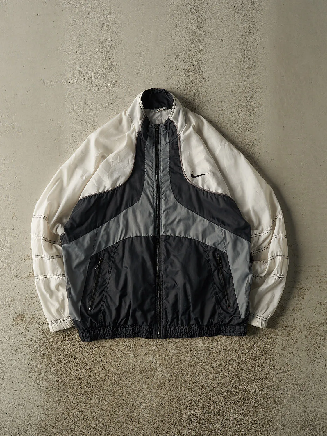 Vintage 90s White Nike Embroidered Windbreaker Jacket (L/XL) sold by Rebalance Vintage