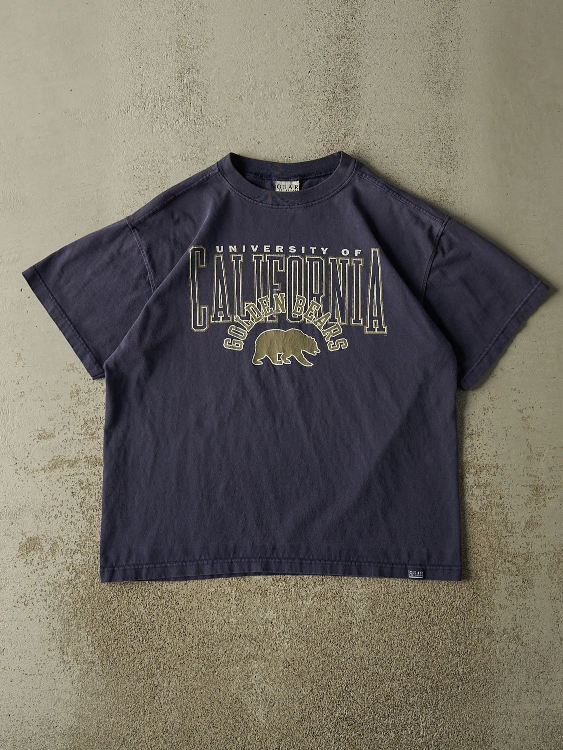 Vintage 90s Navy Blue University of California Golden Bears Tee (L/XL) sold by Rebalance Vintage