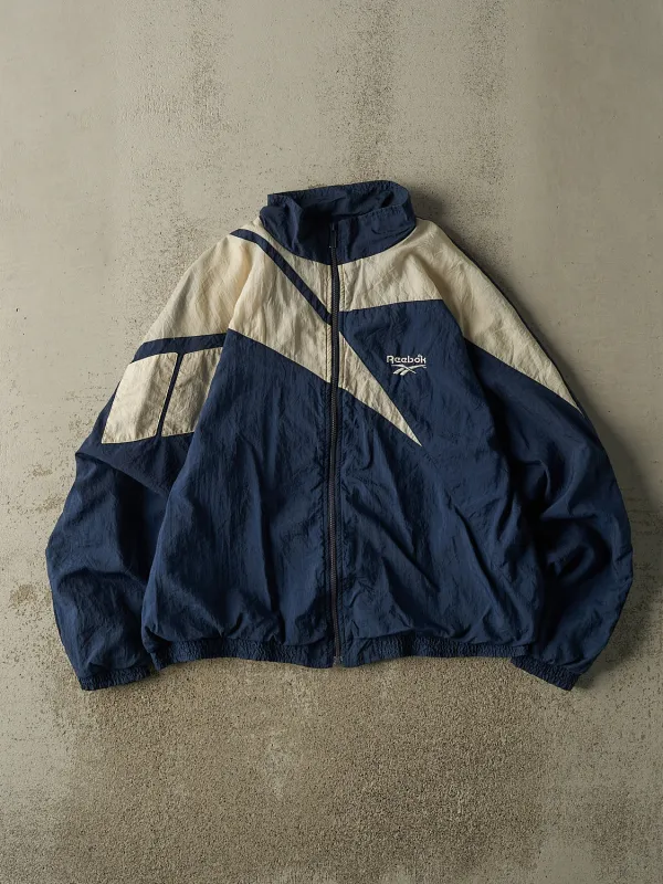 Vintage 90s Navy Blue & White Reebok Windbreaker Jacket (M/L) sold by Rebalance Vintage