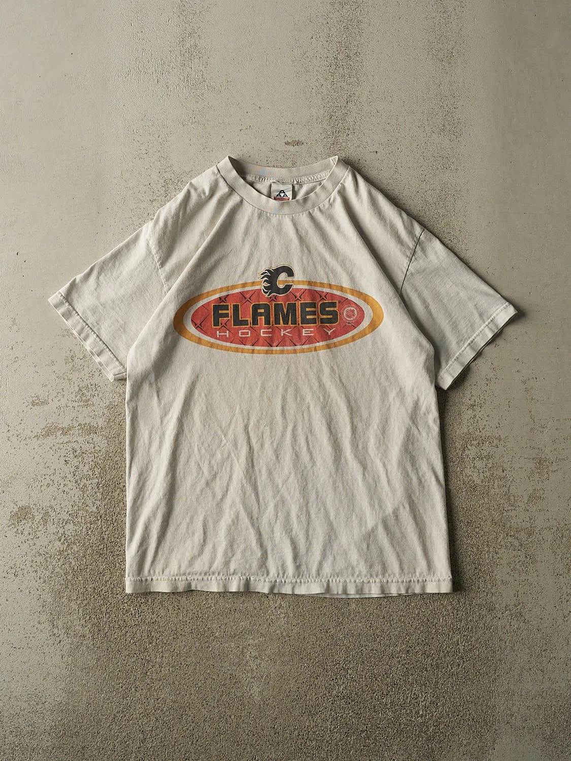 Vintage Y2K Beige Calgary Flames Tee (L) sold by Rebalance Vintage