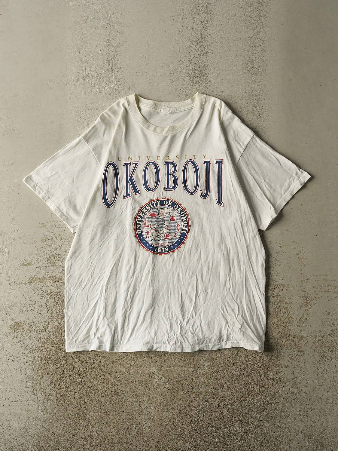 Vintage 90s White University Of Okoboji Tee (XL) sold by Rebalance Vintage