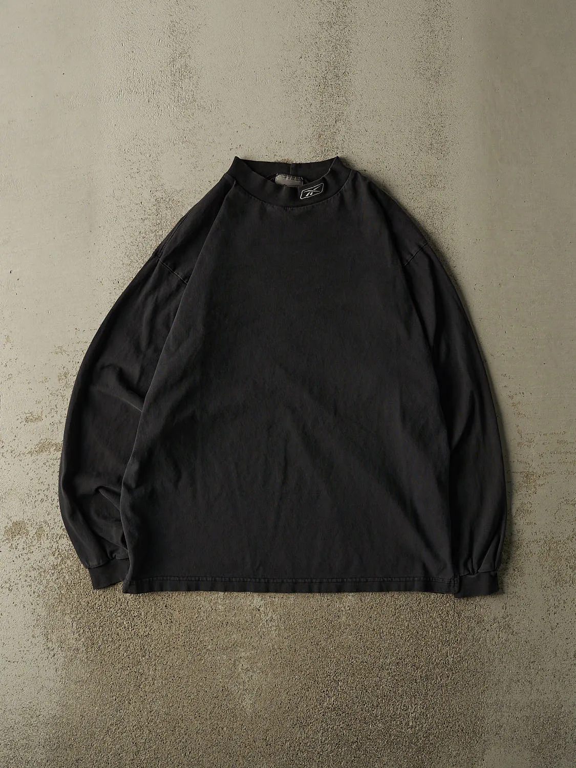 Vintage 90s Faded Black Reebok Mock Neck Long Sleeve (L/XL) sold by Rebalance Vintage