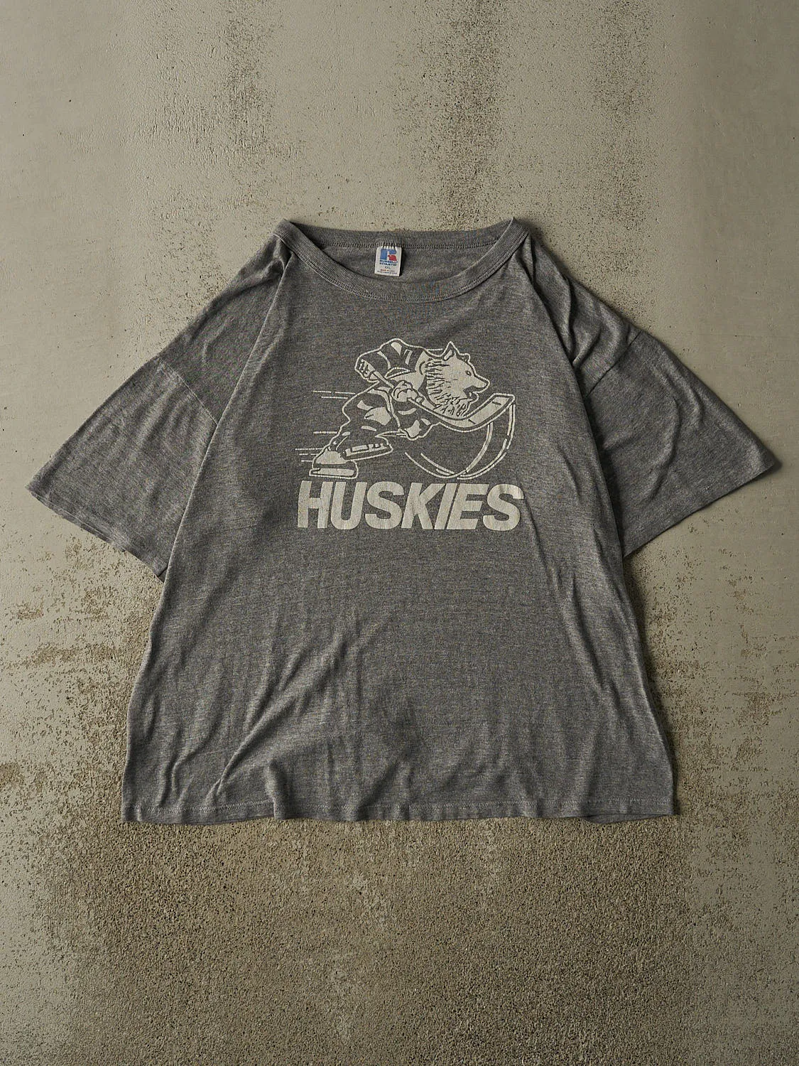 Vintage 90s Grey Russell Athletic Huskies Hockey Tee (XL/XXL) sold by Rebalance Vintage