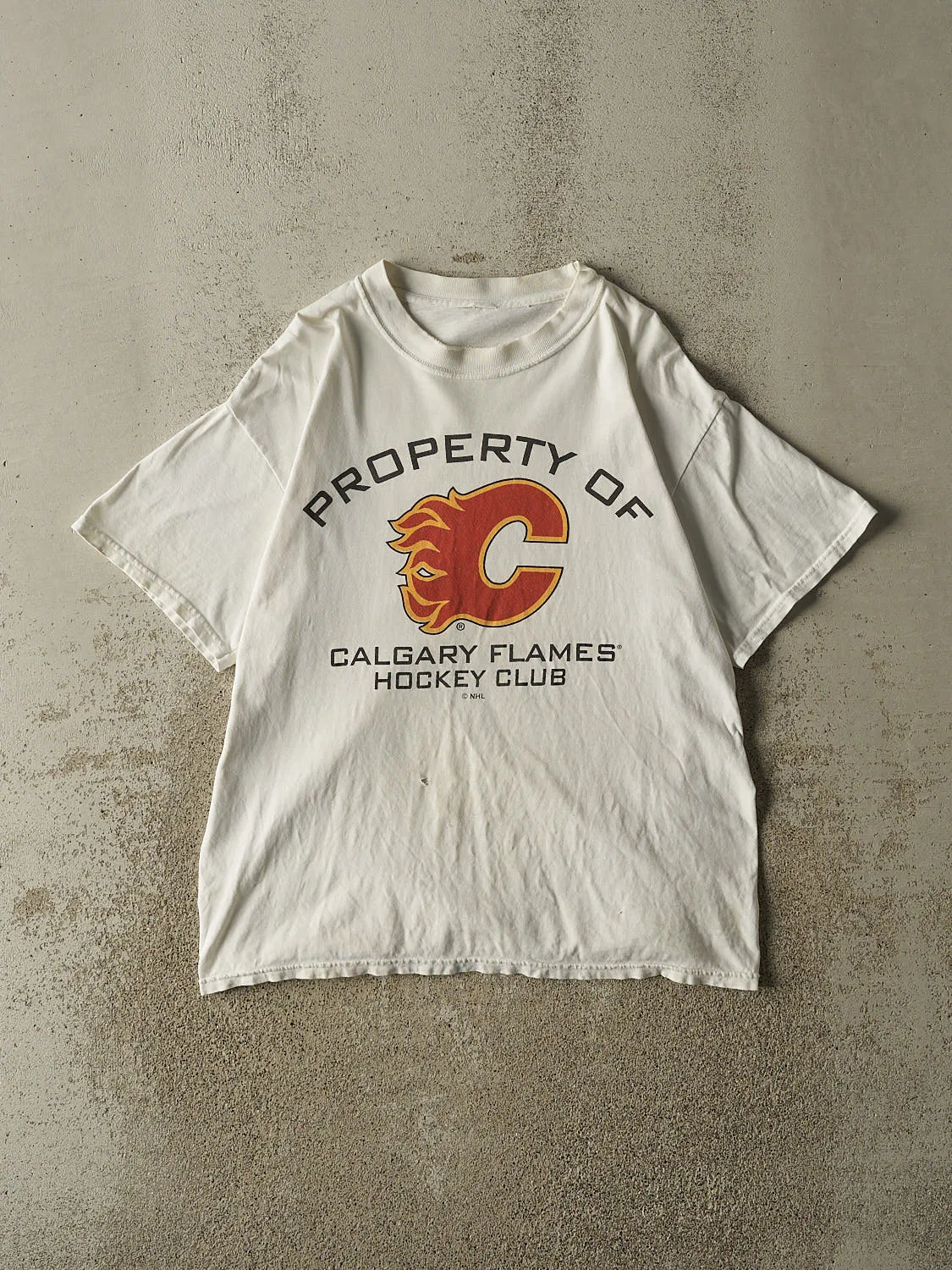 Vintage 90s White Calgary Flames Hockey Tee (L) sold by Rebalance Vintage
