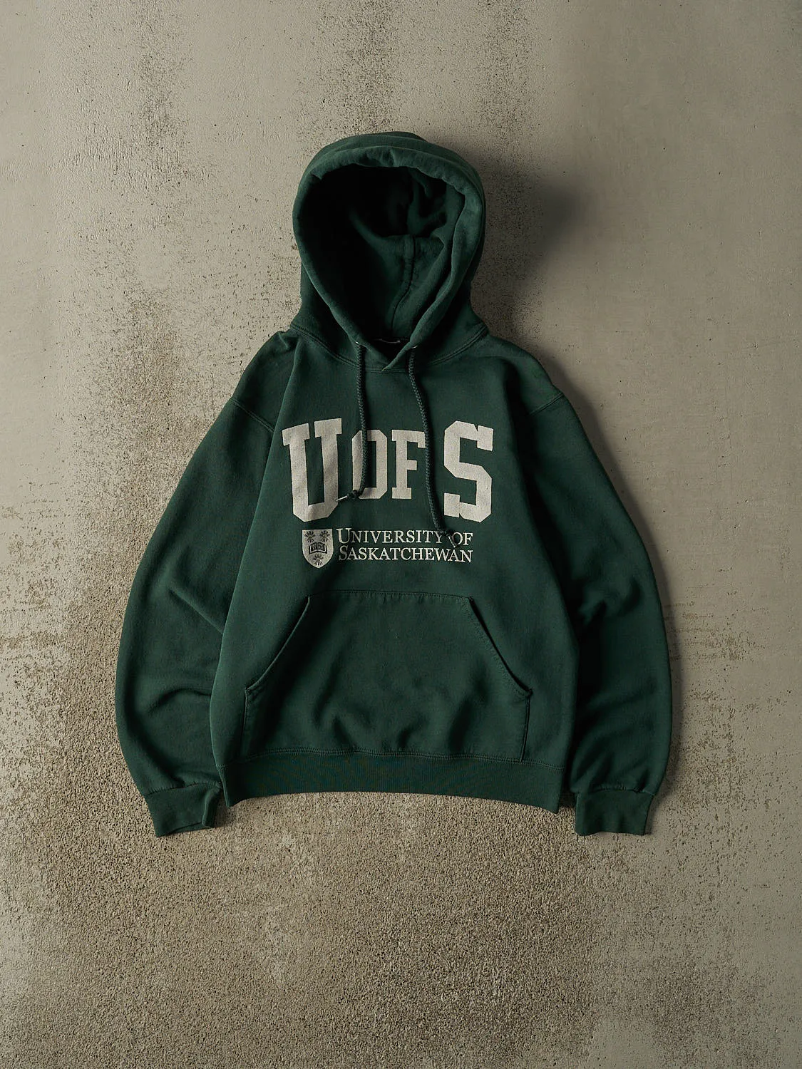Vintage 90s Green University of Saskatchewan Hoodie (XXS/XS) sold by Rebalance Vintage