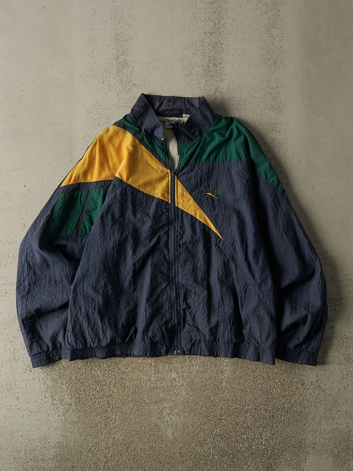 Vintage 90s Navy Blue Colour Block Reebok Windbreaker Jacket (L/XL) sold by Rebalance Vintage