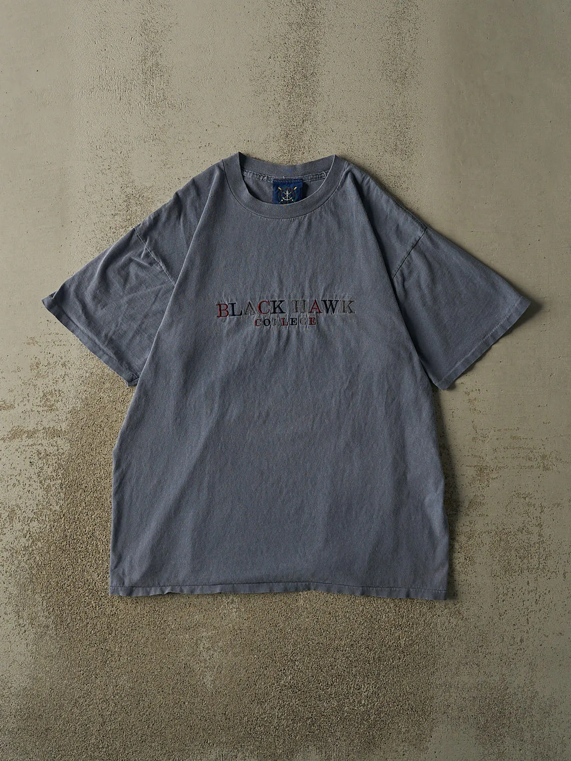 Vintage 90s Blue Black Hawk College Tee (L/XL) sold by Rebalance Vintage