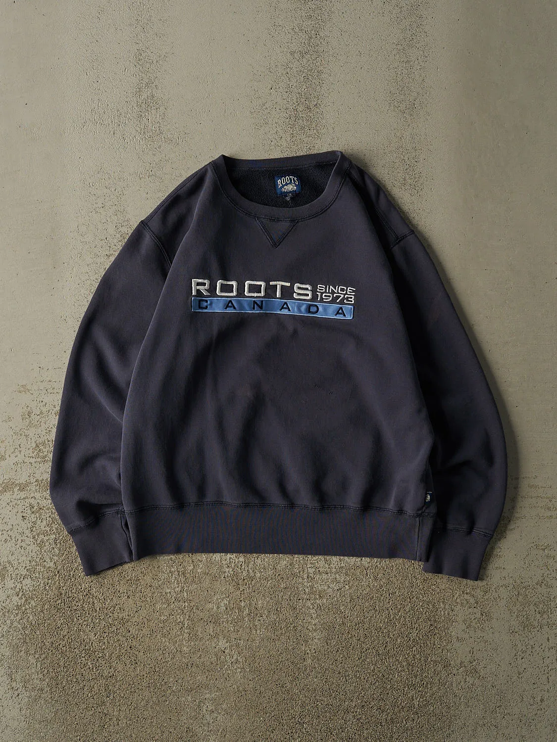Vintage 90s Navy Blue Roots Embroidered Crewneck (M/L) sold by Rebalance Vintage