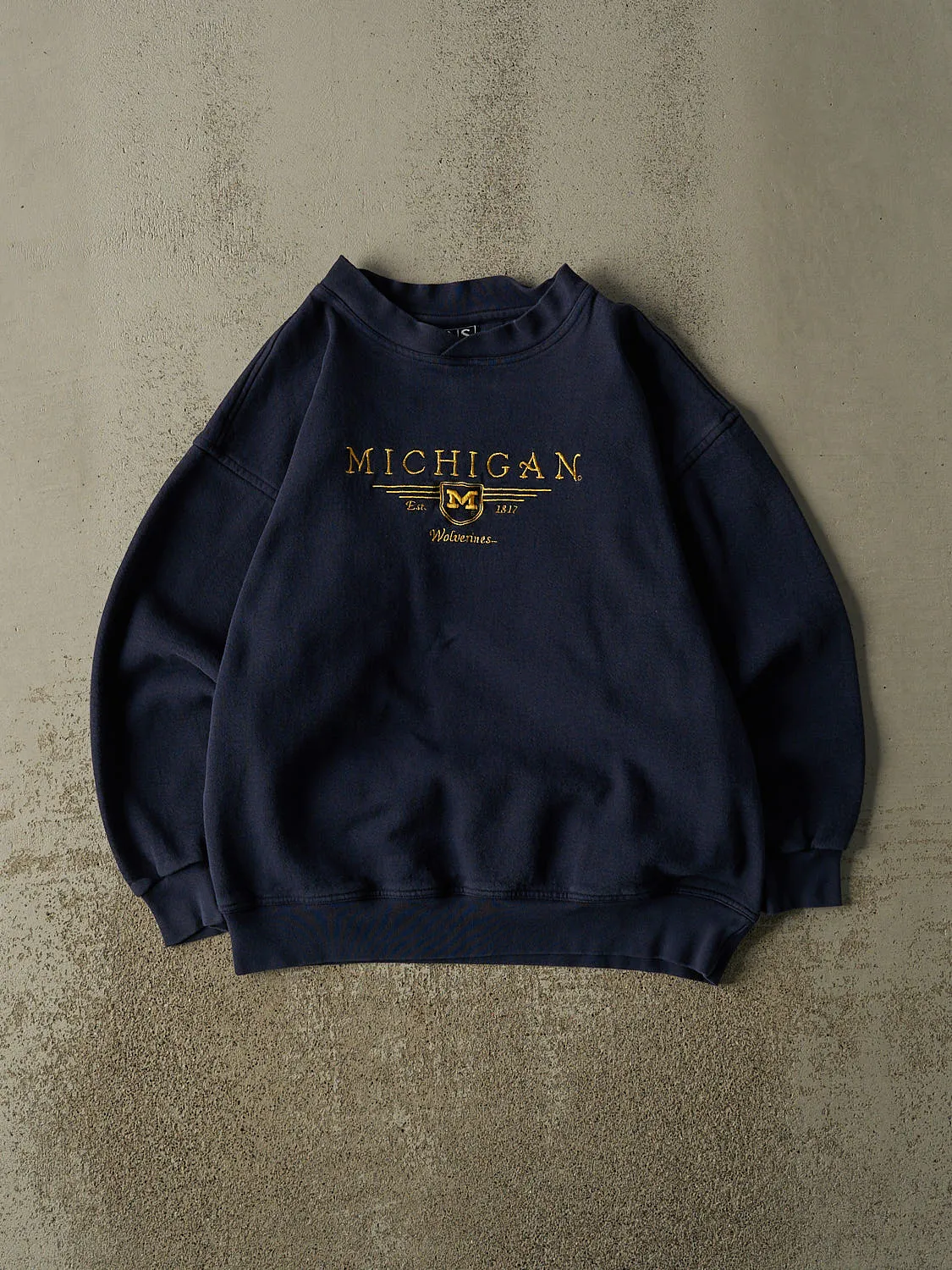 Vintage 90s Navy Blue University of Michigan Wolverines Crewneck (L) sold by Rebalance Vintage