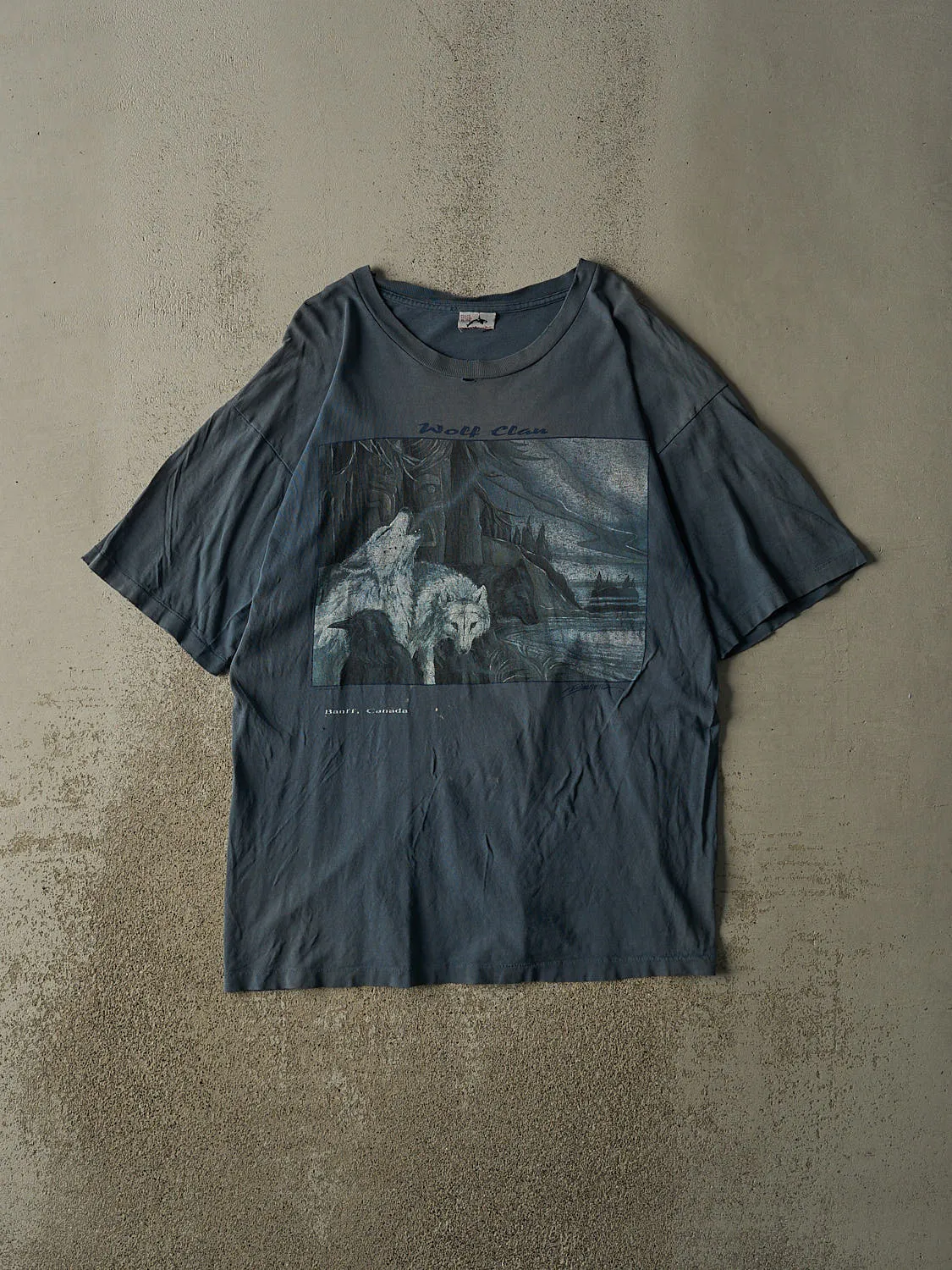 Vintage 90s Slate Blue Banff Wolf Clan Tee (XL/XXL) sold by Rebalance Vintage