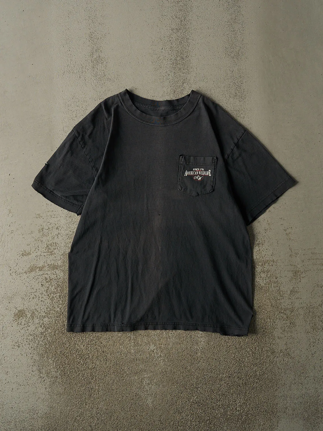 Vintage 90s Faded Black American Wildlife Pocket Tee (L/XL) sold by Rebalance Vintage