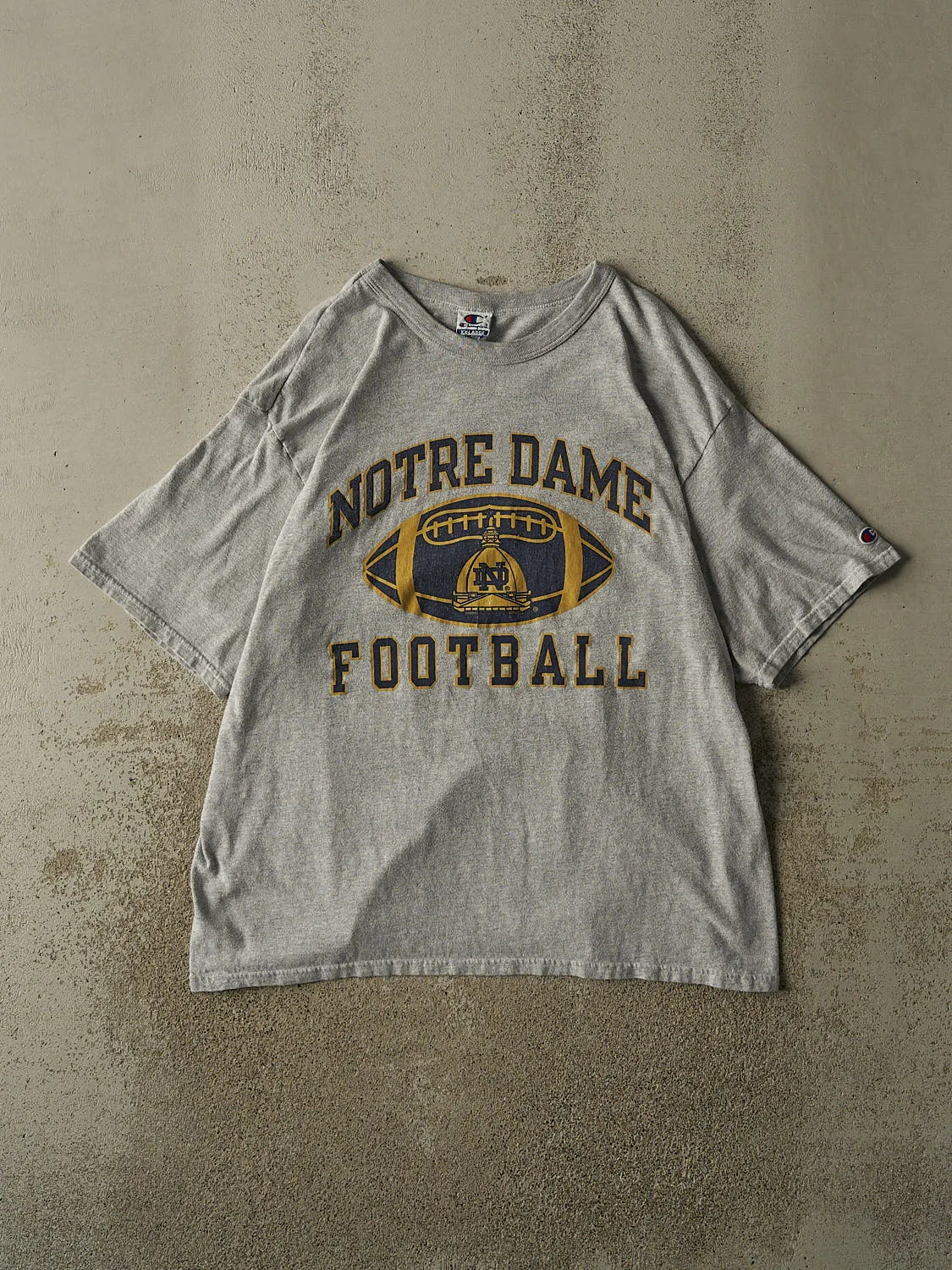 Vintage 90s Grey University Of Notre Dame Football Tee (XL/XXL) sold by Rebalance Vintage