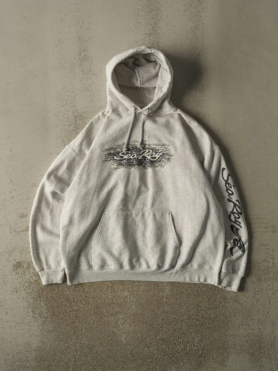 Vintage 90s Heather Grey Sea Ray Hoodie (L/XL) sold by Rebalance Vintage