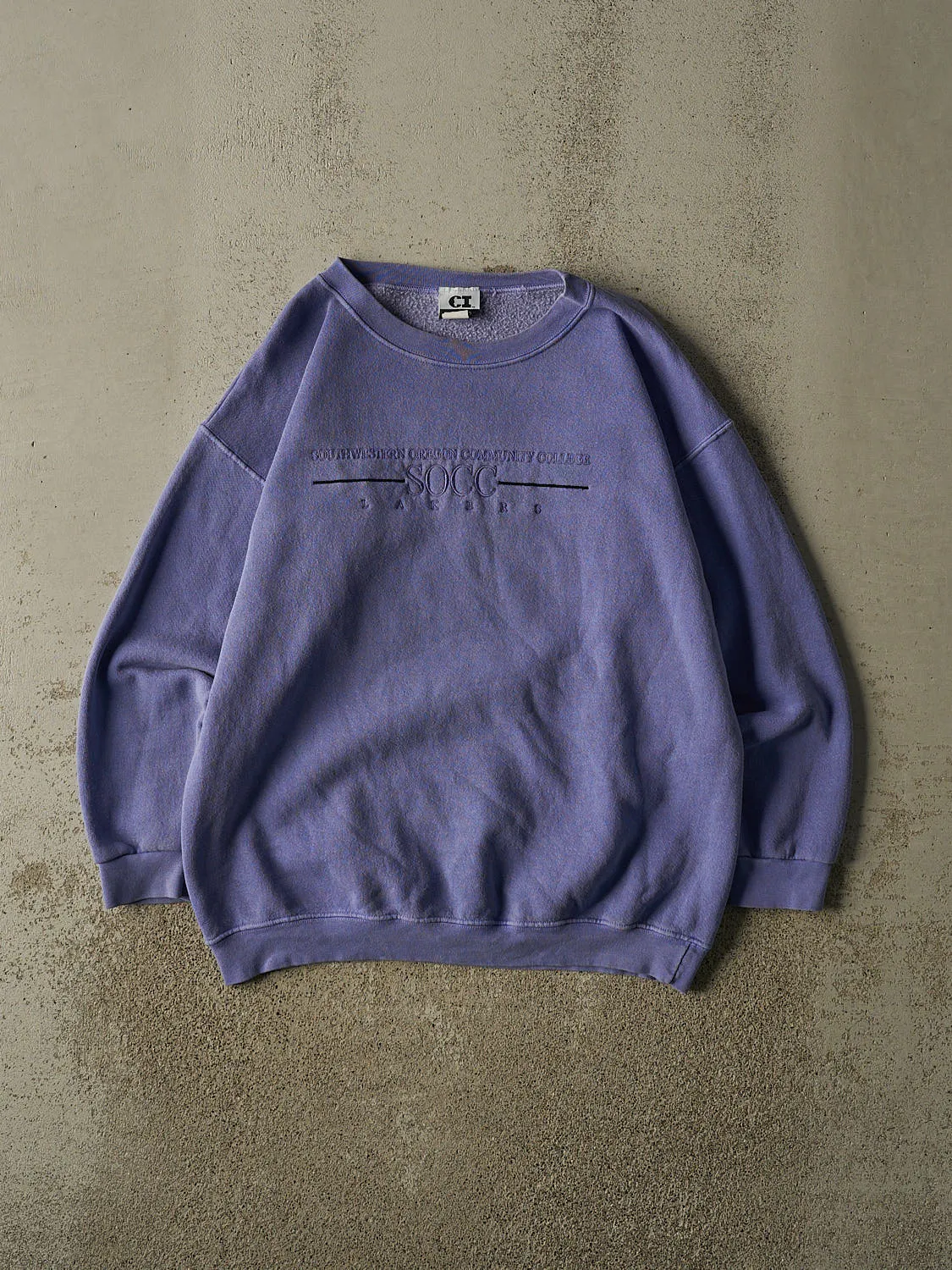 Vintage 90s Purple Southwestern Oregon Community College Crewneck (L) sold by Rebalance Vintage