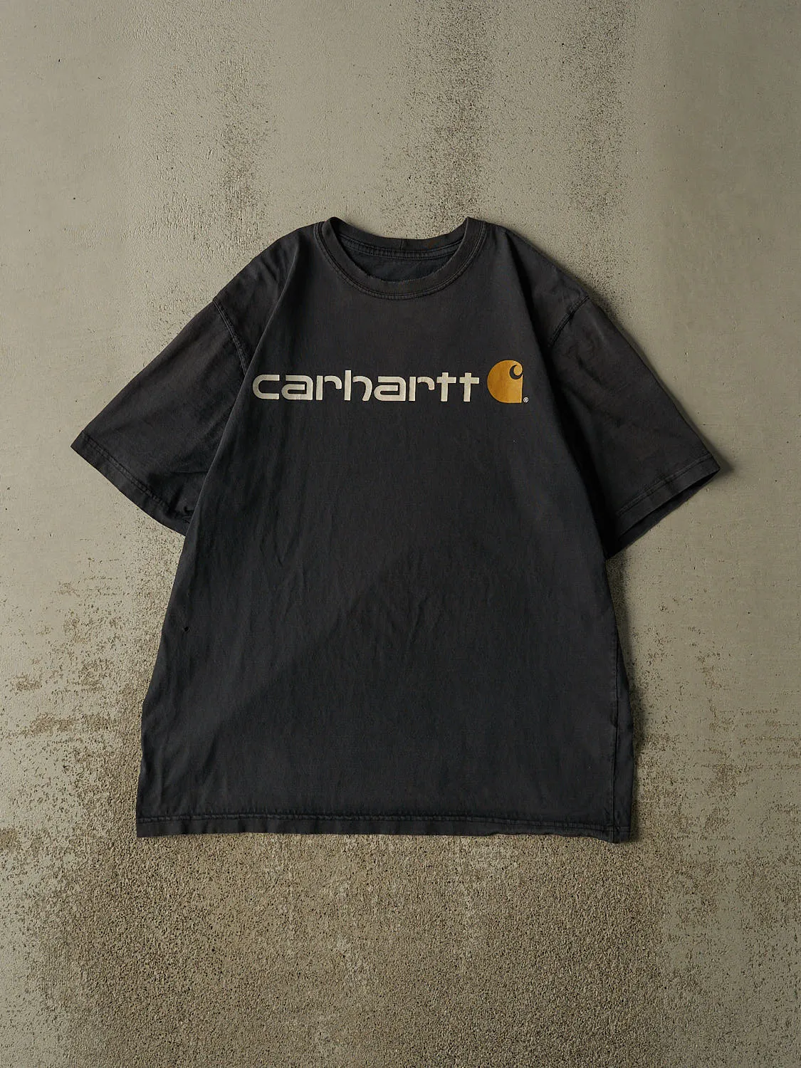 Vintage Y2K Faded Black Carhartt Logo Tee (L/XL) sold by Rebalance Vintage