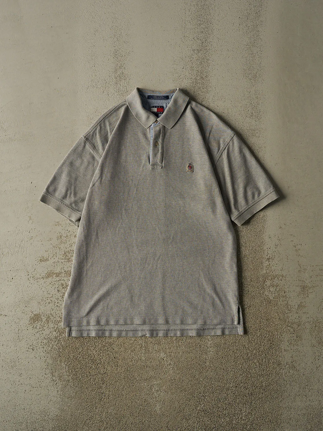 Vintage 90s Grey Tommy Hilfiger Embroidered Quarter Button Tee (L/XL) sold by Rebalance Vintage