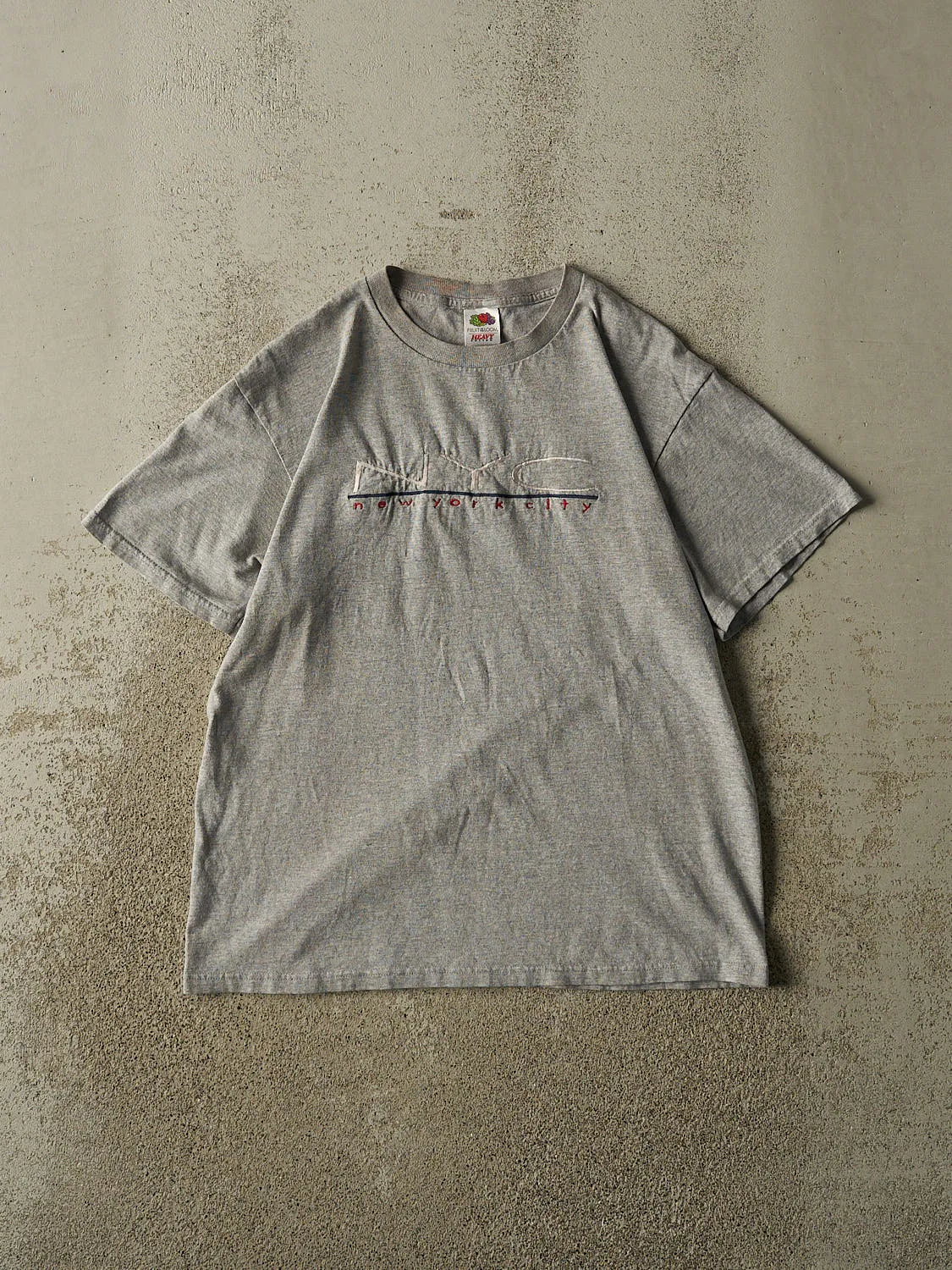 Vintage 90s Grey New York City Embroidered Tee (M) sold by Rebalance Vintage