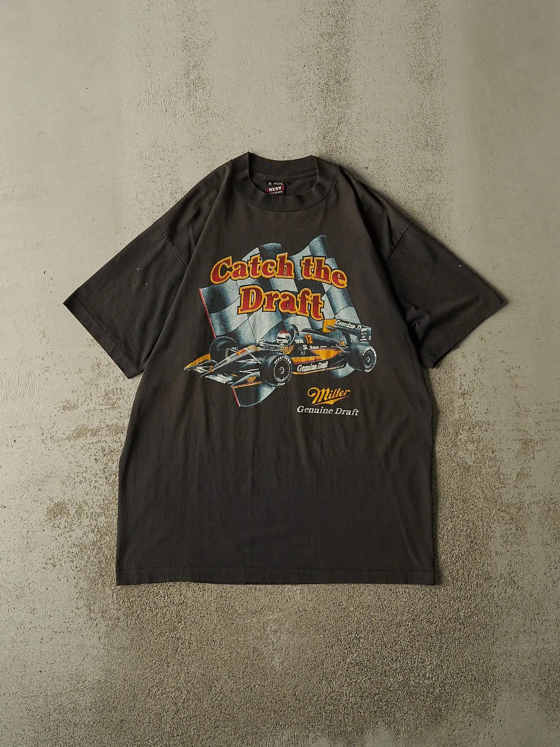 Vintage 90s Faded Black Miller Genuine Draft Single Stitch "Catch The Draft" Racing Tee (L/XL) sold by Rebalance Vintage