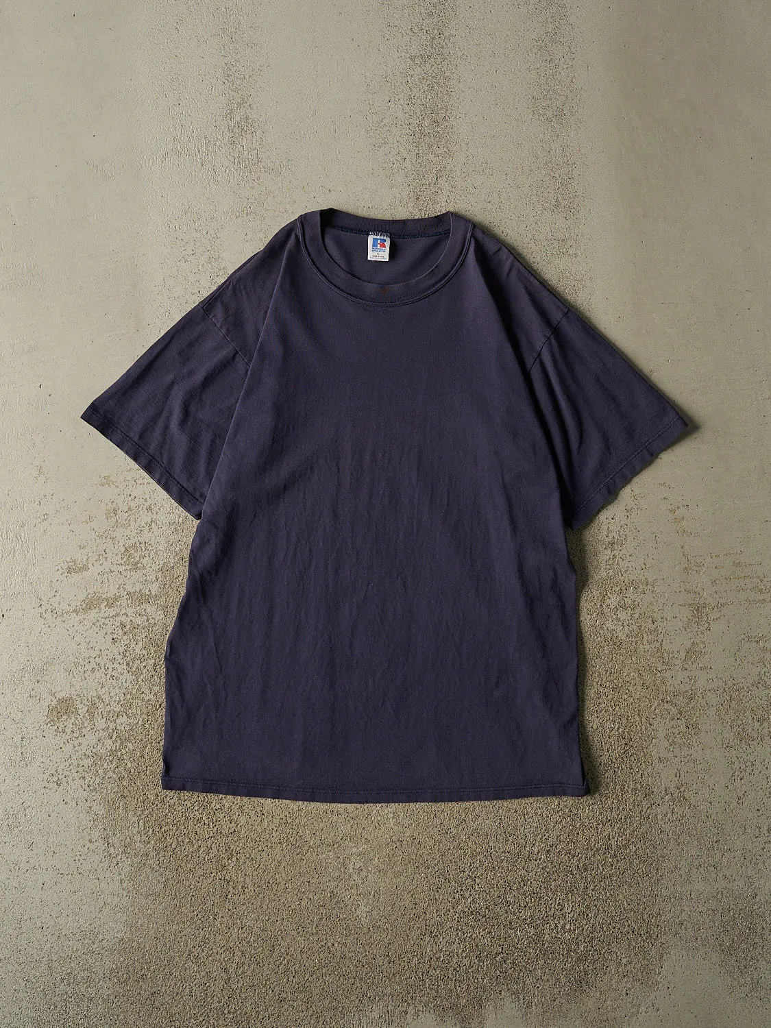 Vintage 90s Navy Blue Russell Athletic Blank Tee (L/XL) sold by Rebalance Vintage