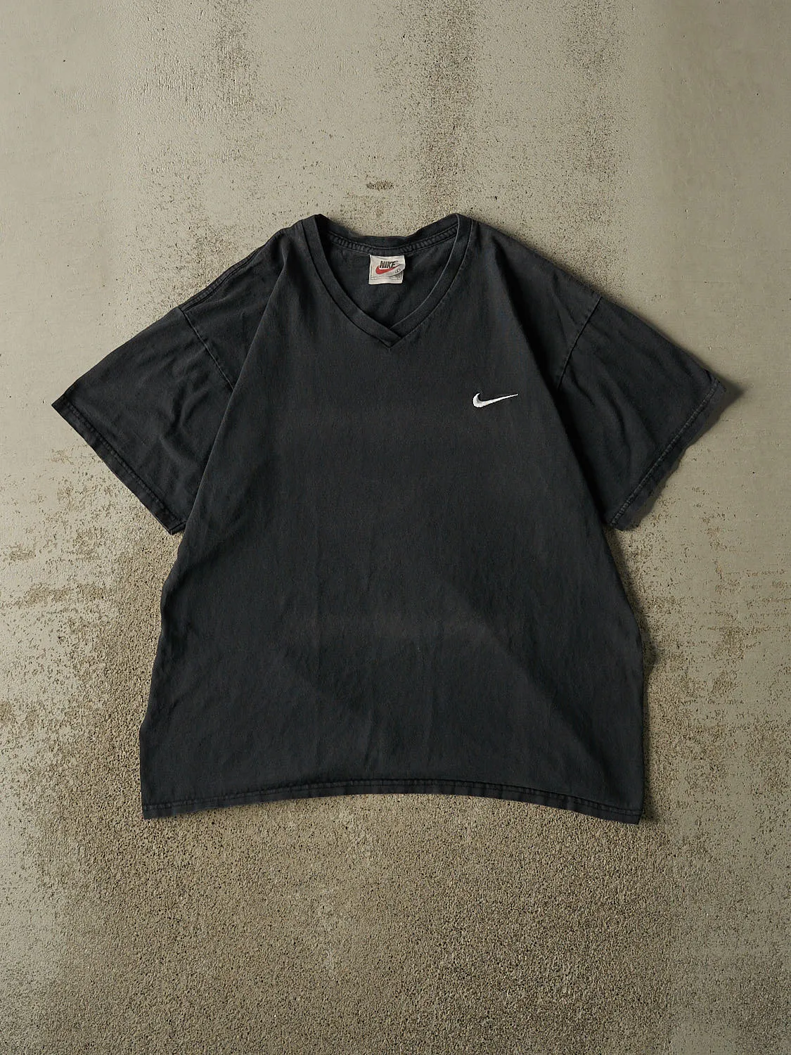 Vintage 90s Faded Black Nike Embroidered V-Neck Tee (M/L) sold by Rebalance Vintage