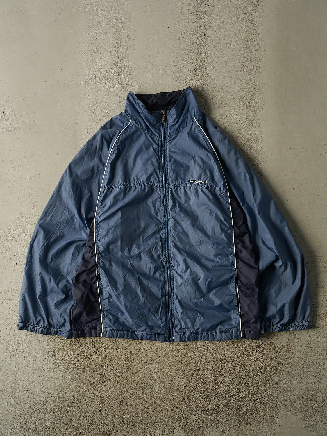 Vintage Y2K Blue Reebok Zip Up Windbreaker Jacket (XL/XXL) sold by Rebalance Vintage