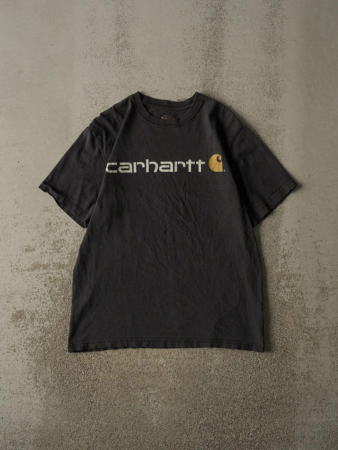 Vintage Y2K Faded Black Carhartt Logo Tee (L) sold by Rebalance Vintage