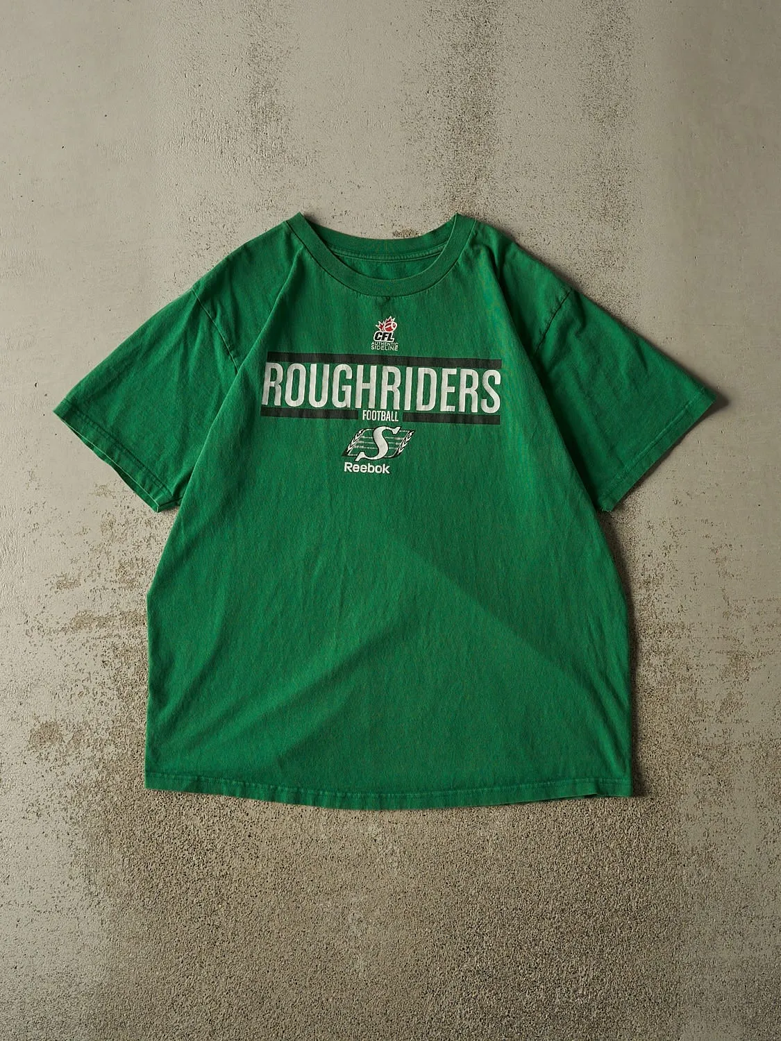 Vintage Y2K Green Saskatchewan Roughriders Tee (L/XL) sold by Rebalance Vintage