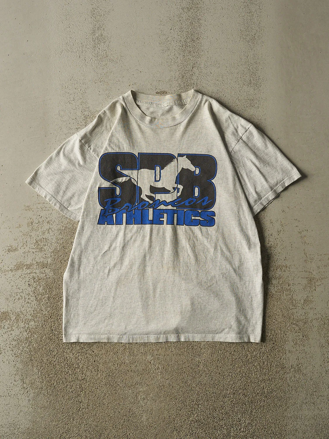 Vintage 90s Grey SPB Broncos Tee (M/L) sold by Rebalance Vintage