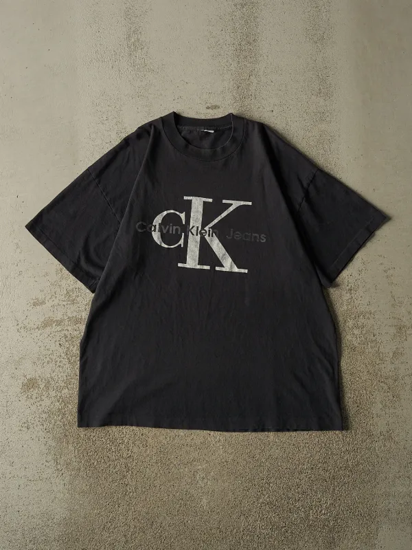 Vintage 90s Black Calvin Klein Jeans Single Stitch Tee (XL) made by Rebalance Vintage