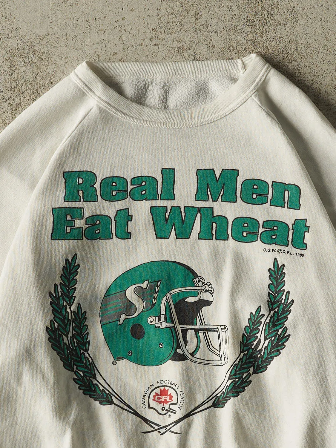 Vintage 89' White Saskatchewan Roughriders "Real Men Eat Wheat" Crewneck (S) sold by Rebalance Vintage product image thumbnail 3