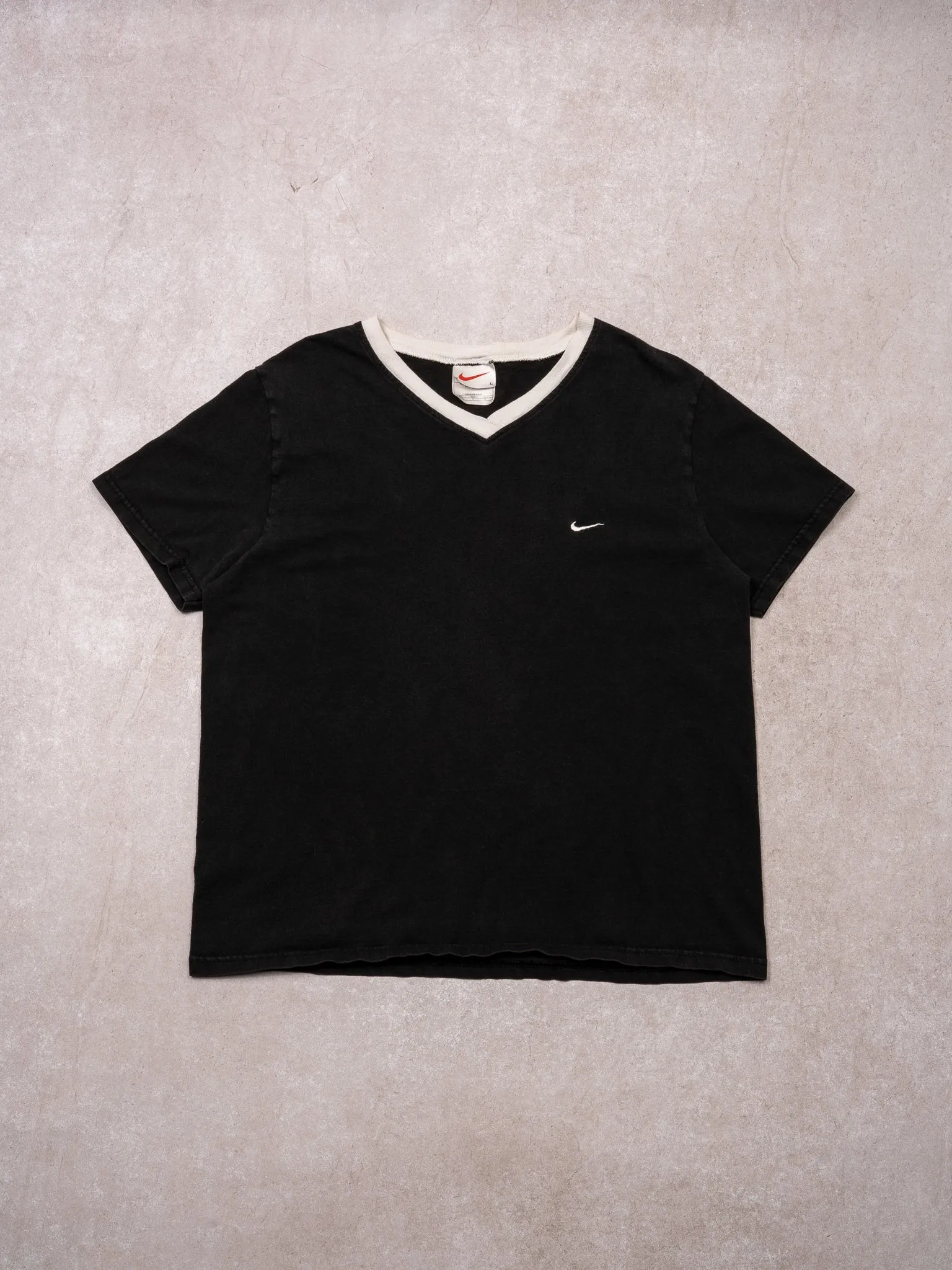 Vintage 90s Washed Black + White Nike V Neck Tee (S) sold by Rebalance Vintage