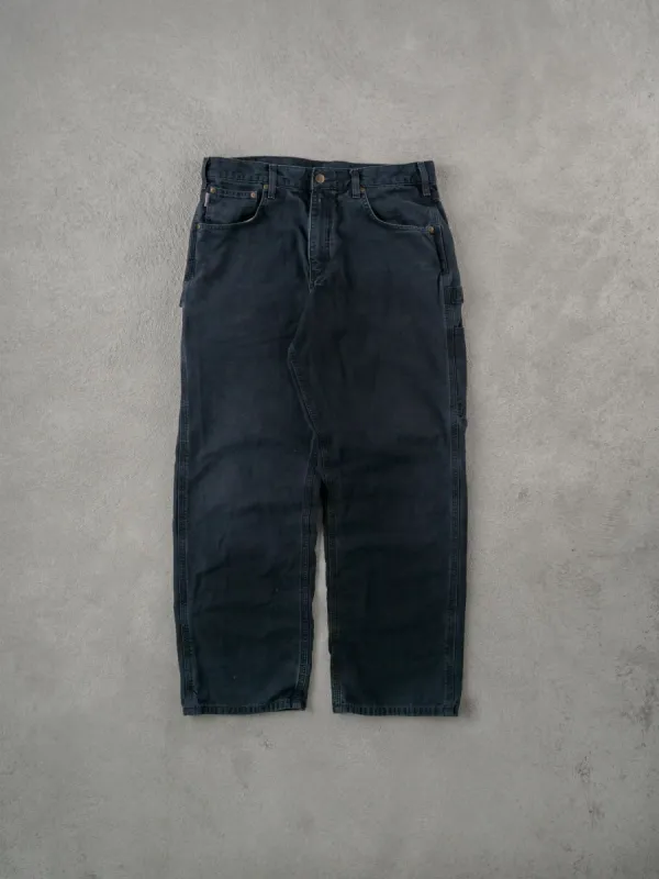 Vintage 90s Black Carhartt Carpenter Pants (34x30) sold by Rebalance Vintage