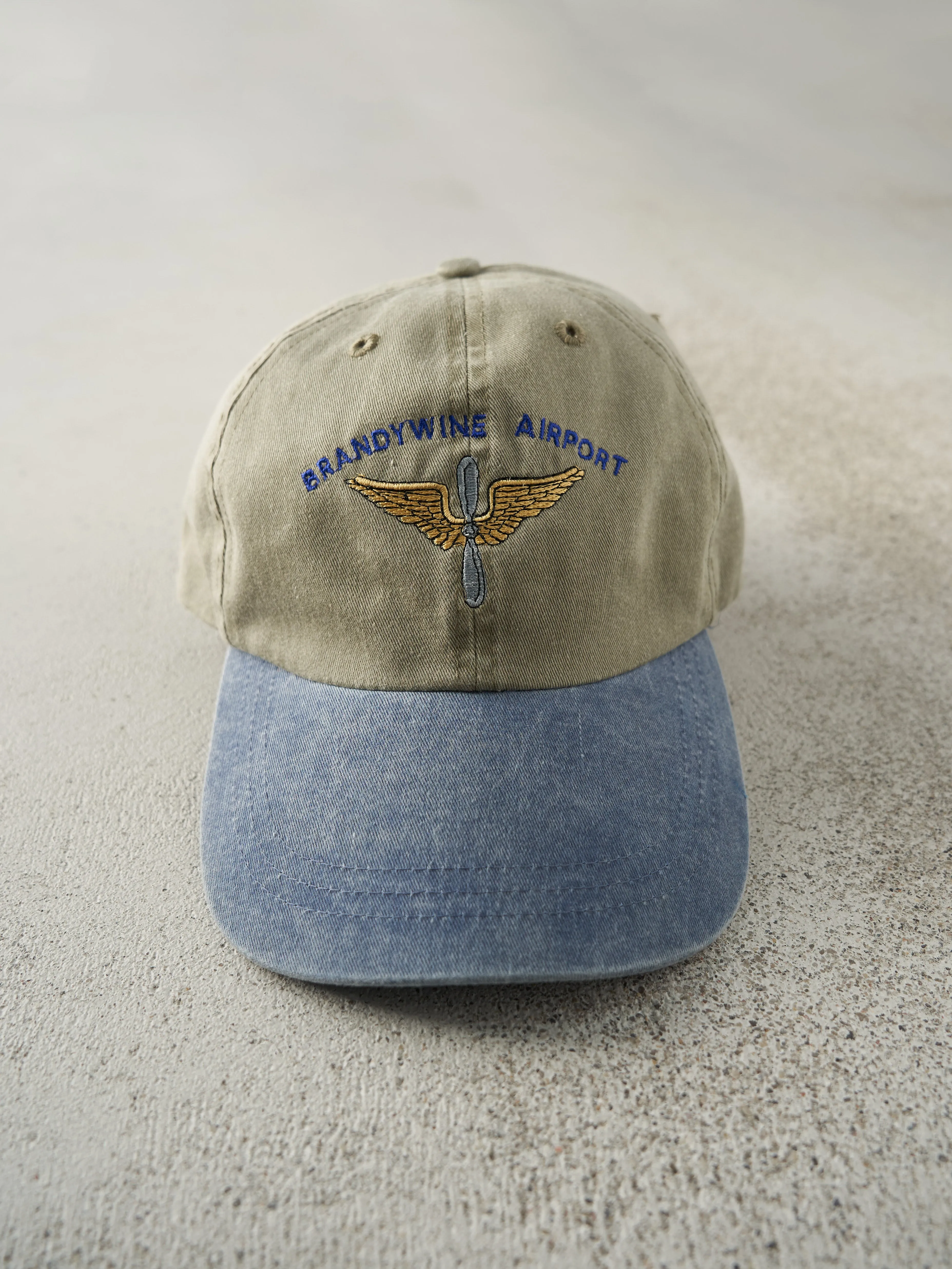 Vintage 90s Beige & Blue Brandywine Airport Leather Strap Back Hat sold by Rebalance Vintage