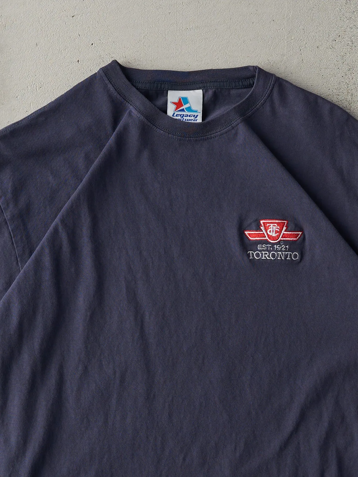 Vintage 90s Navy Blue TTC Embroidered Logo Tee (M) sold by Rebalance Vintage product image thumbnail 2
