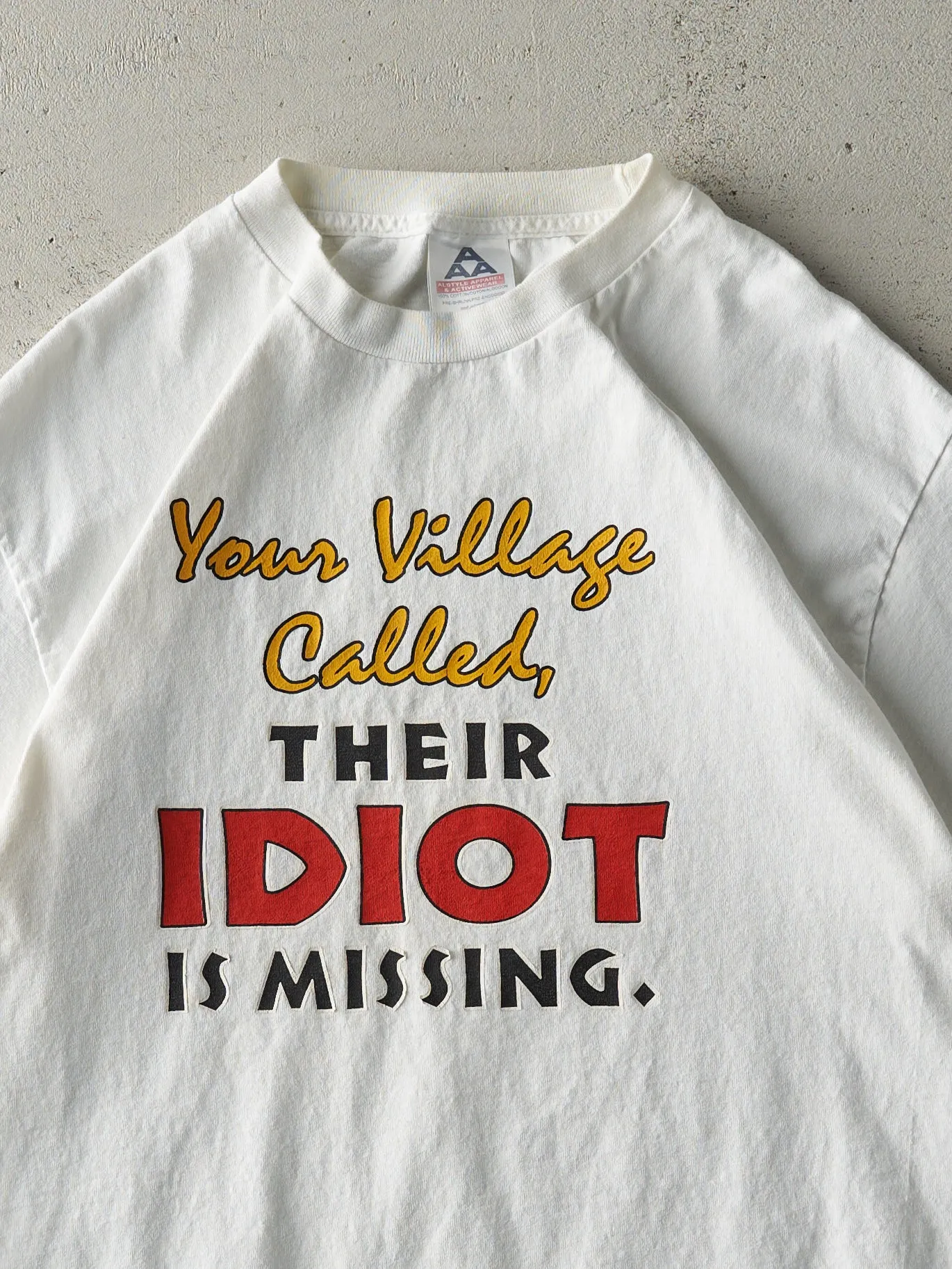 Vintage Y2K White Village Idiot Slogan Tee (M) sold by Rebalance Vintage product image thumbnail 2