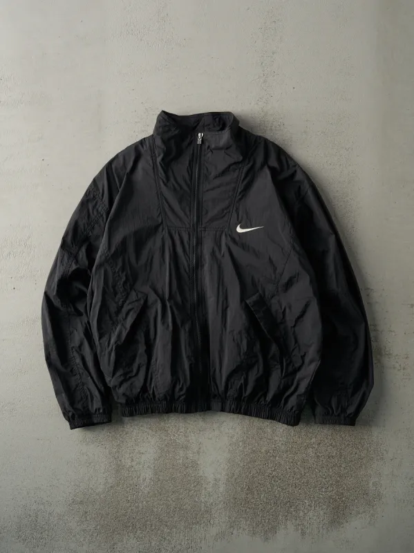 Vintage 90s Black Nike Windbreaker Jacket (L) sold by Rebalance Vintage