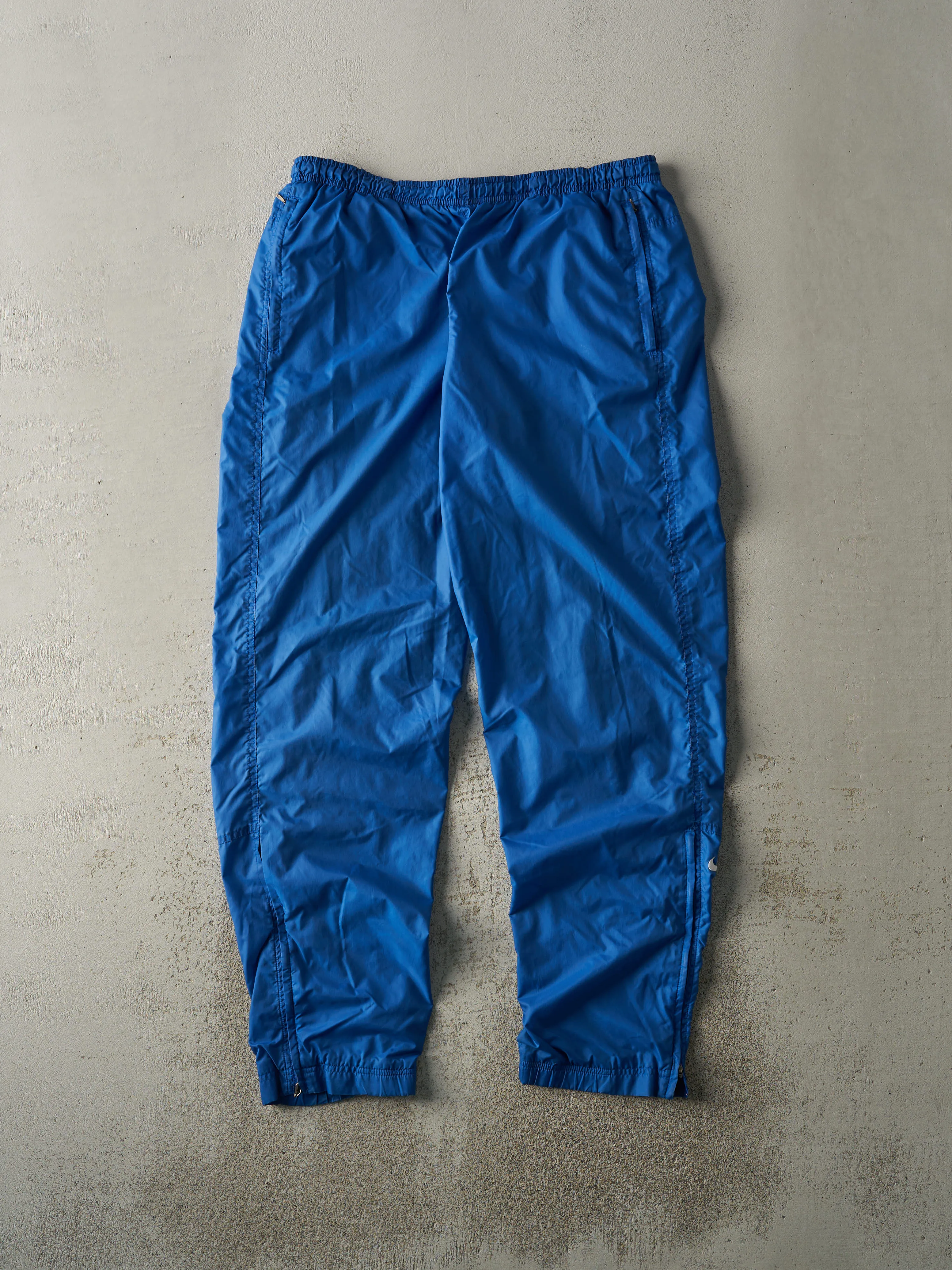 Vintage Y2K Blue Nike Embroidered Logo Track Pants (34x32) sold by Rebalance Vintage