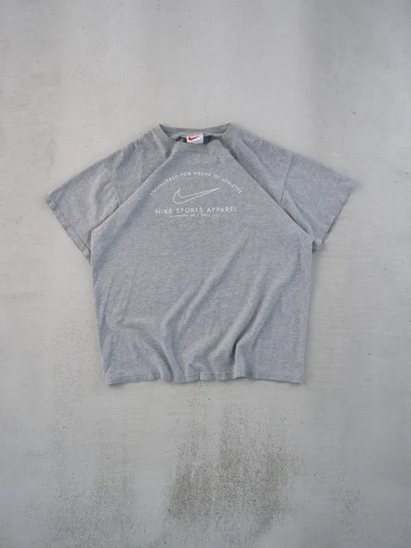 Vintage 90s Grey Nike Sports Apparel Graphic Tee (M) sold by Rebalance Vintage