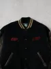 Vintage 90s Black and Brown Roots x CIBC Varsity Jacket (M) sold by Rebalance Vintage