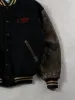 Vintage 90s Black and Brown Roots x CIBC Varsity Jacket (M) sold by Rebalance Vintage