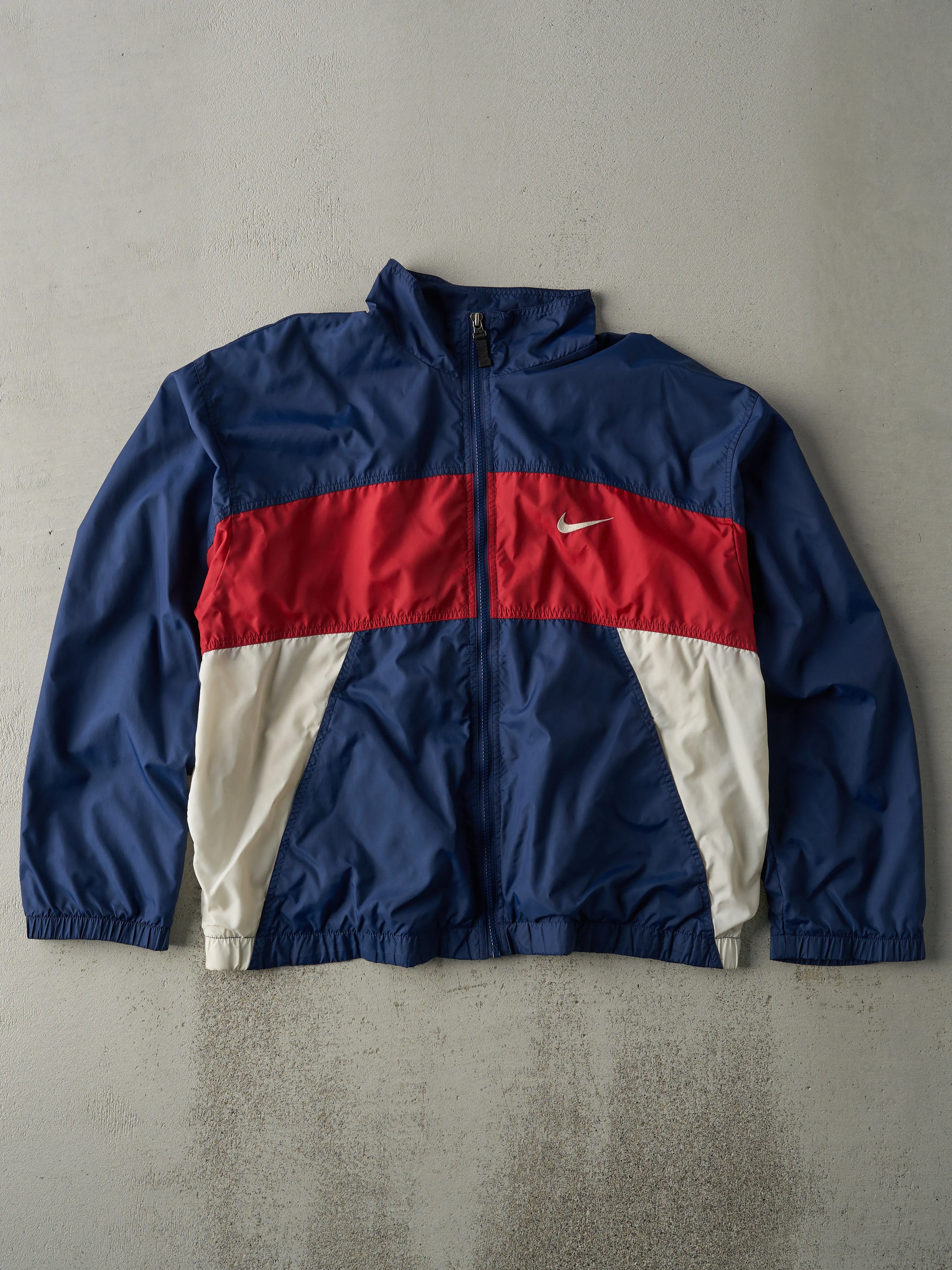 Vintage 90s Navy, Red & White Nike Windbreaker Jacket (M) sold by Rebalance Vintage
