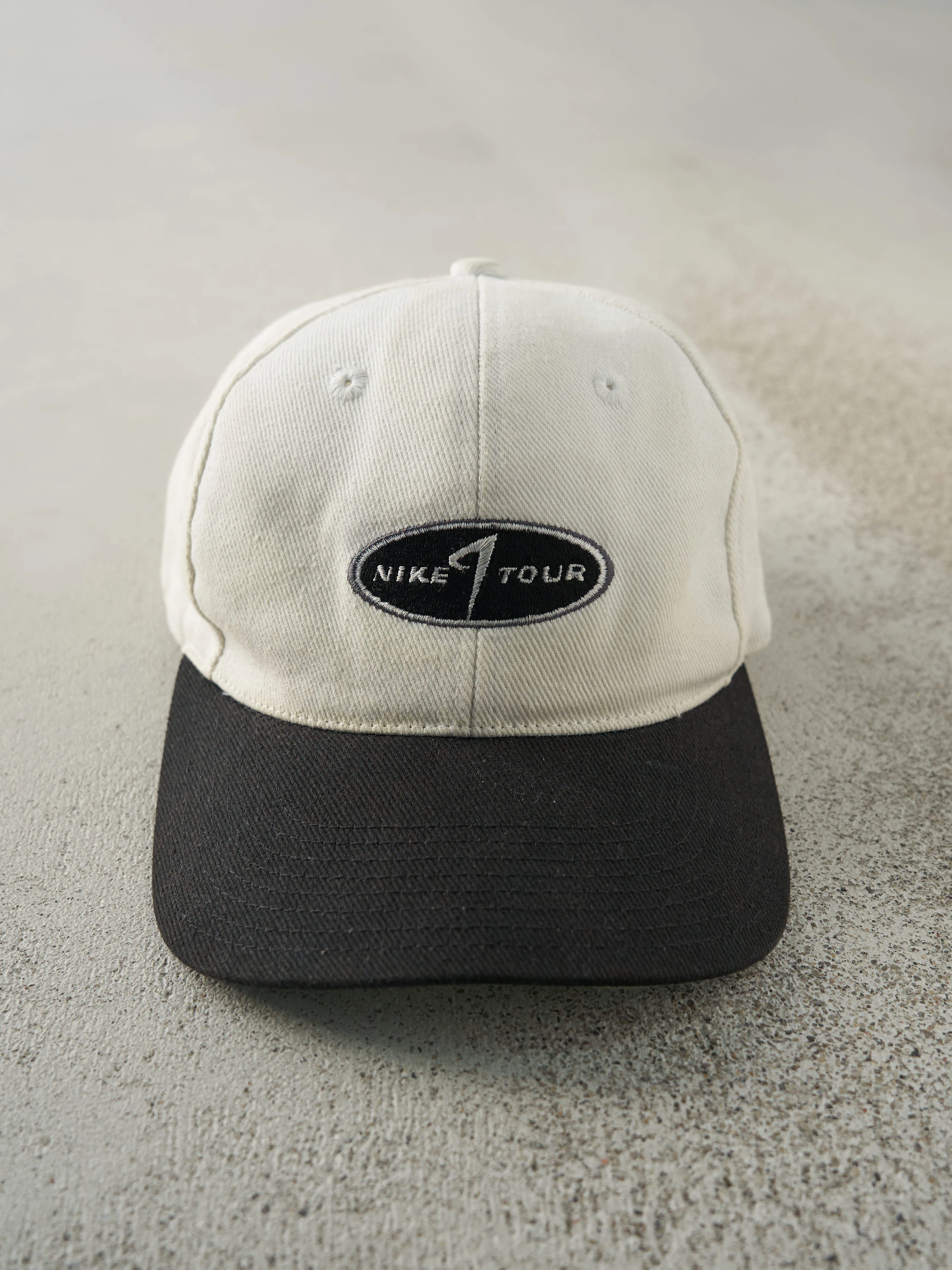 Vintage Y2K Beige & Black Nike Tour Golf Velcro Back Hat sold by Rebalance Vintage