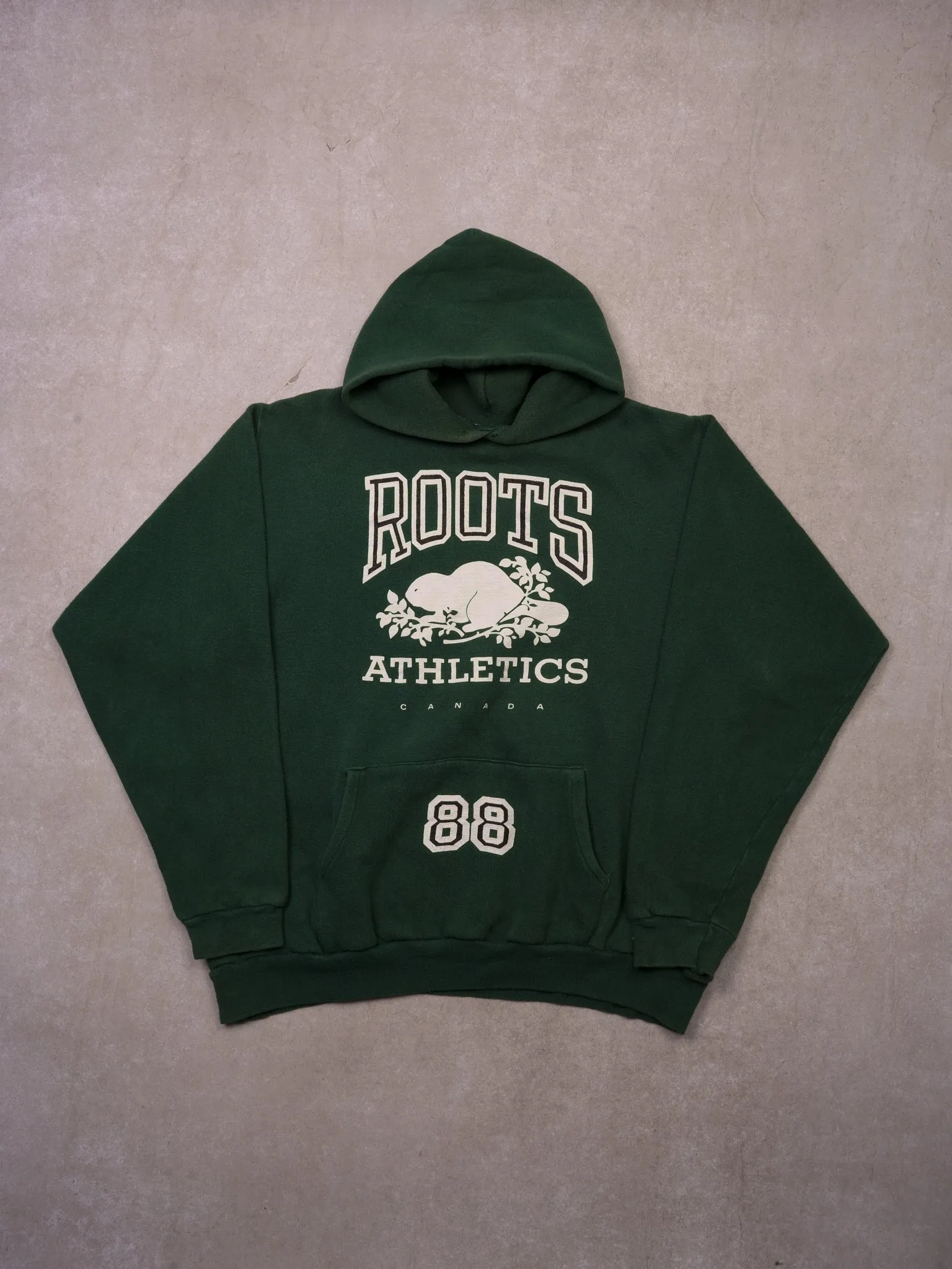 Vintage 90s Oak Green Roots Athletics 88 Hoodie (L/XL) sold by Rebalance Vintage