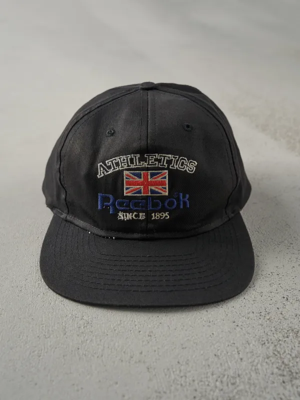 Vintage 80s Black Embroidered Reebok Snapback Hat sold by Rebalance Vintage