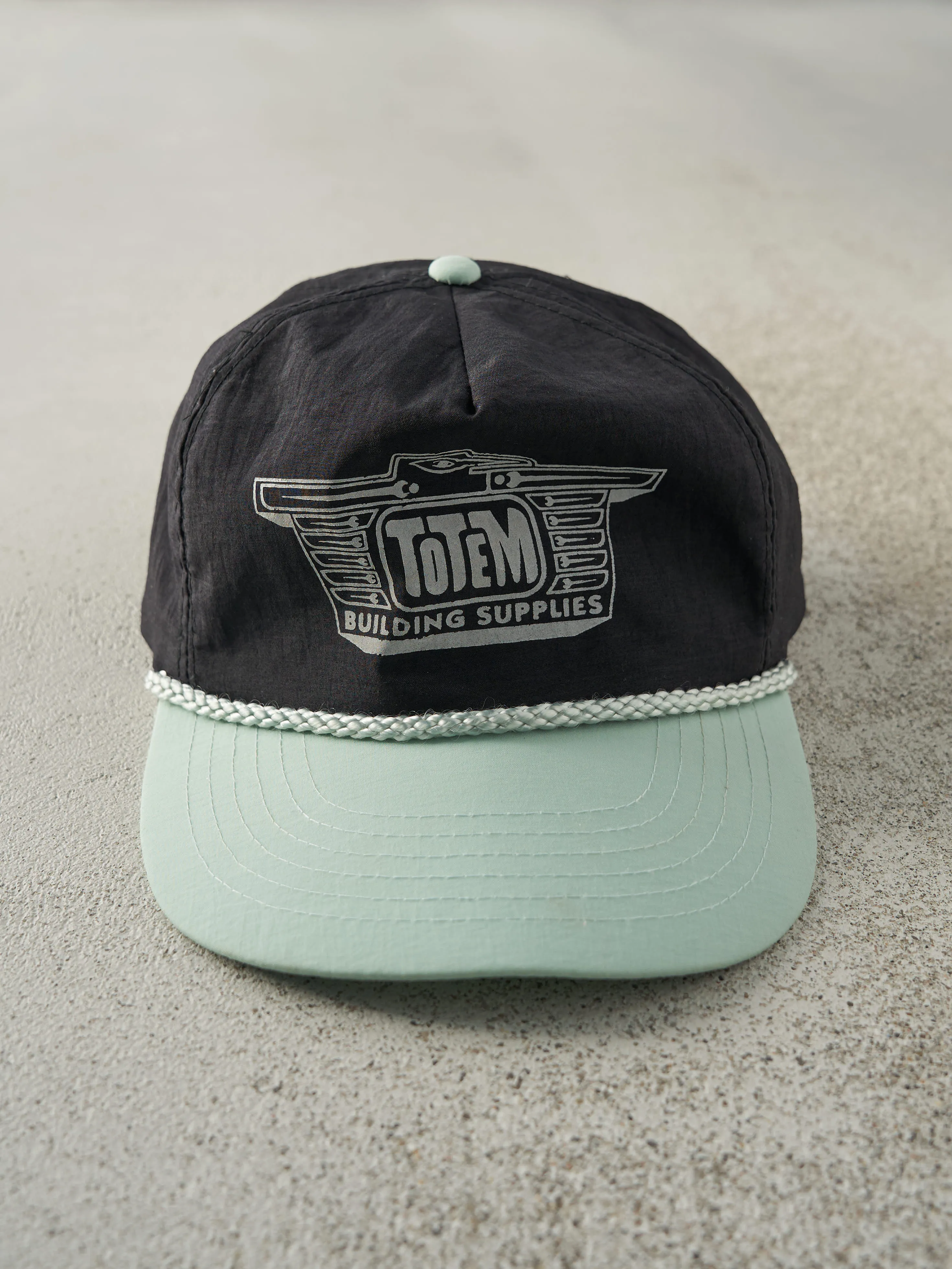 Vintage 90s Black & Grey Totem Building Supplies Snapback Hat sold by Rebalance Vintage