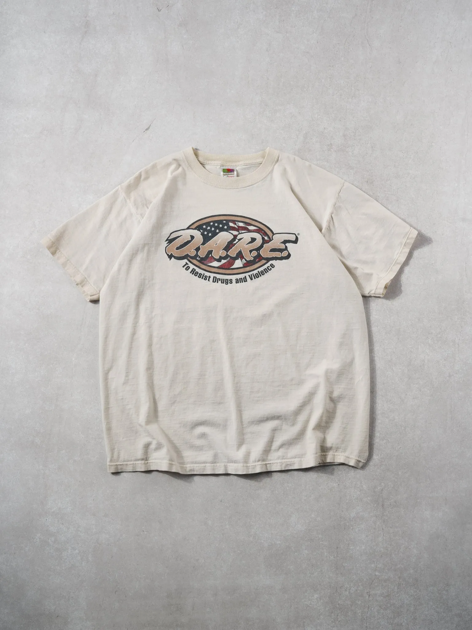 Vintage 90 Beige "DARE" America Graphic Tee (L) sold by Rebalance Vintage