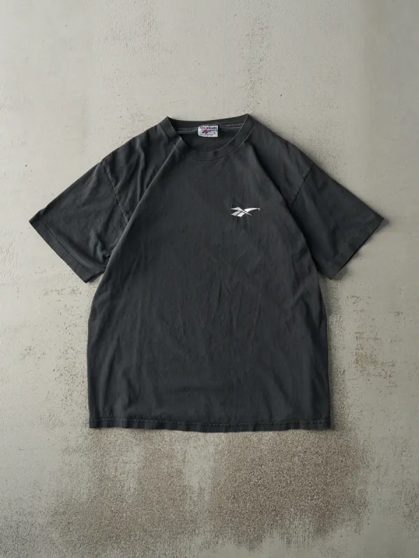 Vintage 90s Faded Black Embroidered Reebok Logo Tee (M/L) sold by Rebalance Vintage