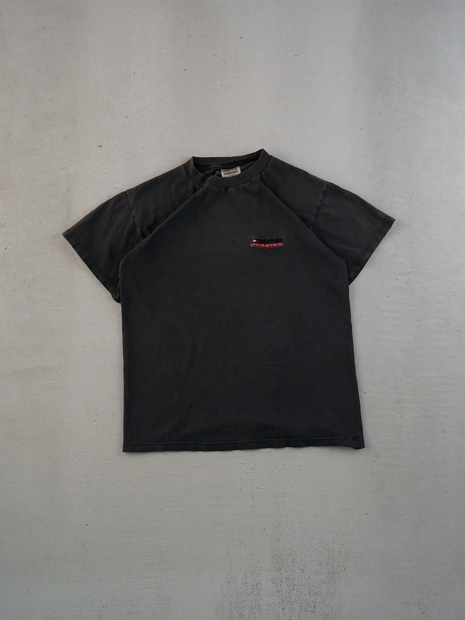 Vintage 90s Washed Black Tommy Hilfiger Athletics Tee (S) sold by Rebalance Vintage